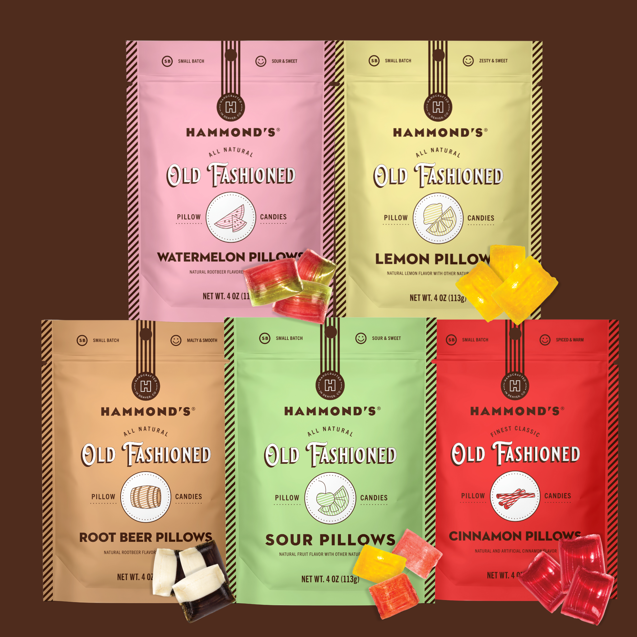 Six bags of Hammond's Old Fashioned Pillow Candy arranged in a 2x3 grid on a dark brown background, with loose candy pieces scattered around them. The bags are colored pink, yellow, tan, green, and red, corresponding to the different flavor variants.