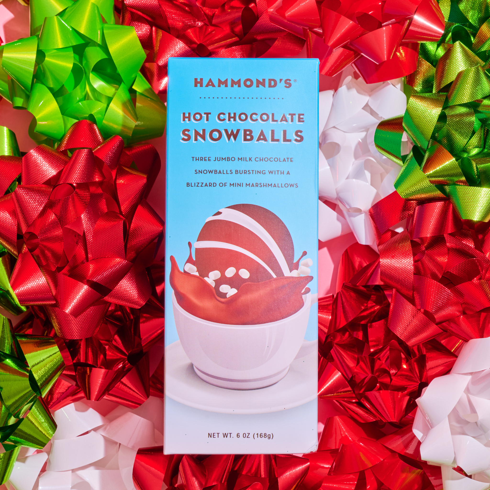 hot chocolate snowballs on bed of christmas bows